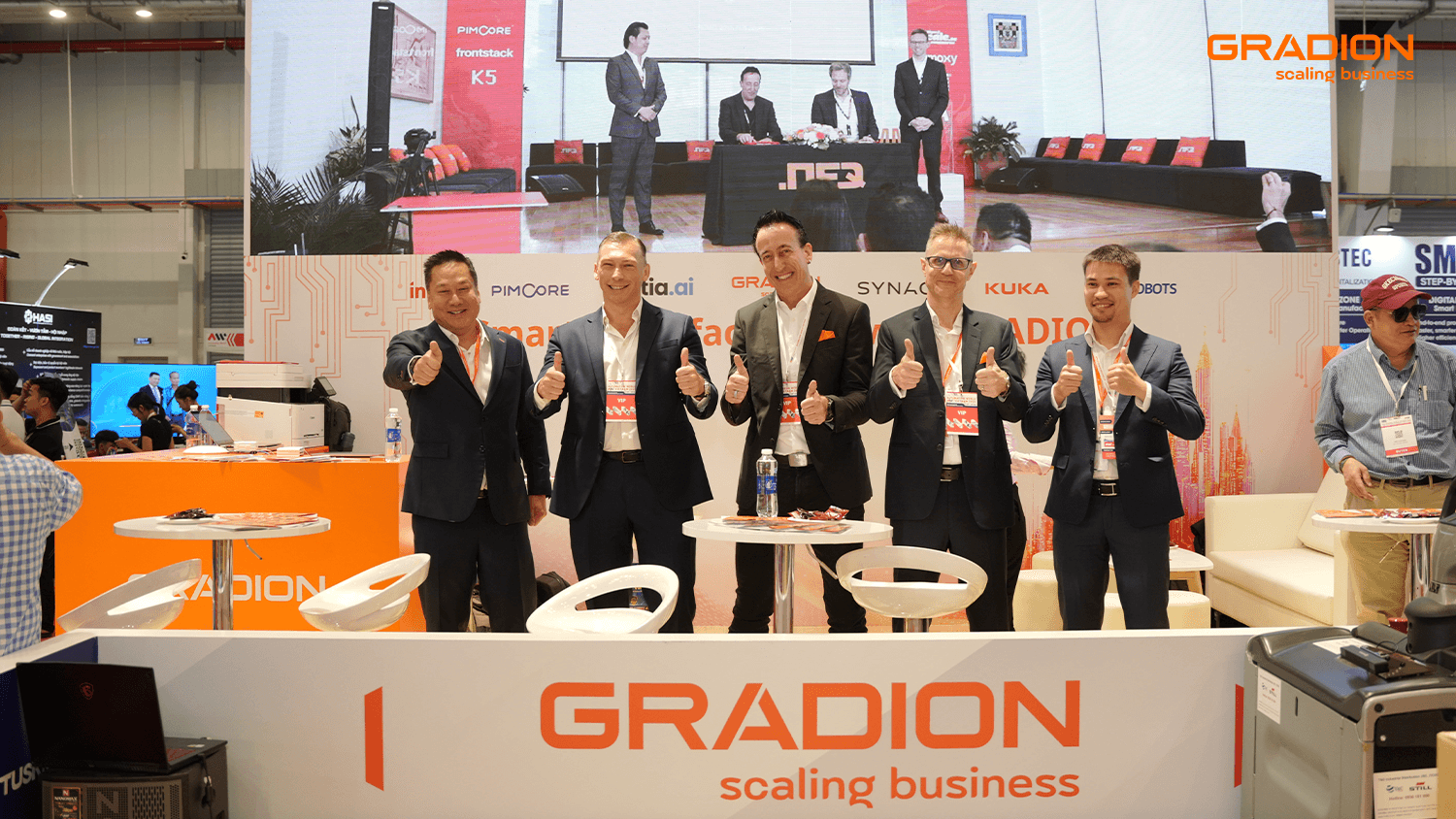 Gradion Trade Show Booth Team Thumbs Up