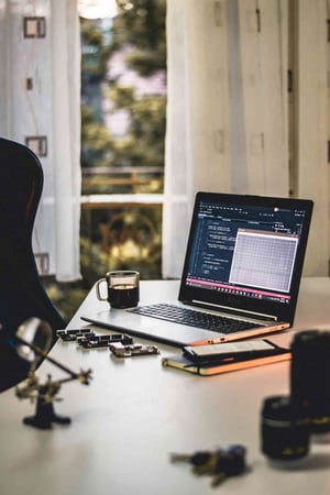 Laptop on a desk displaying code, representing engineering reports and live debrief workflows. Laptop on a desk displaying code, representing engineering reports and live debrief workflows.